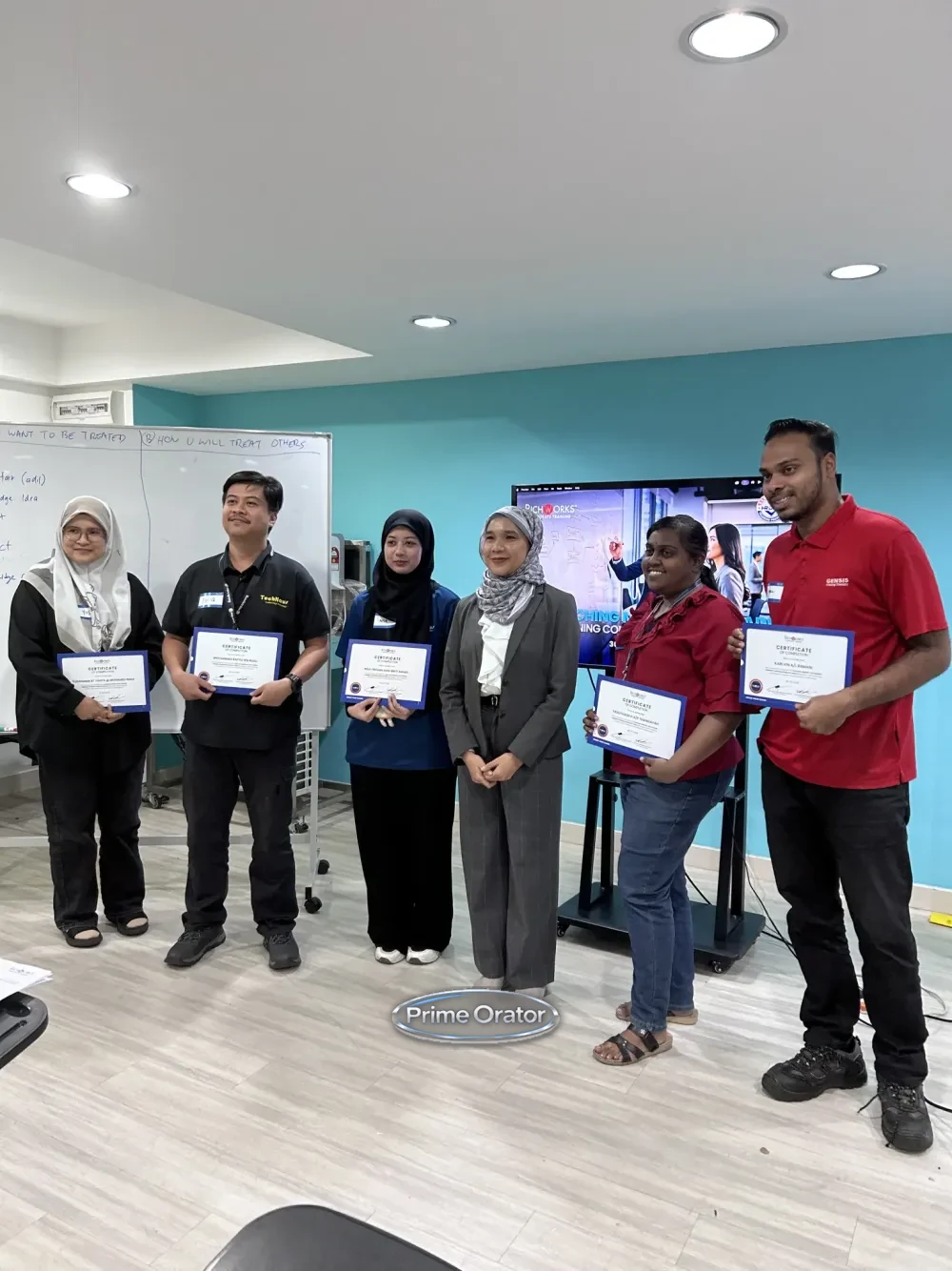 Participants receiving certificates of completion at a Prime Orator Coaching Mindset for Leaders training session