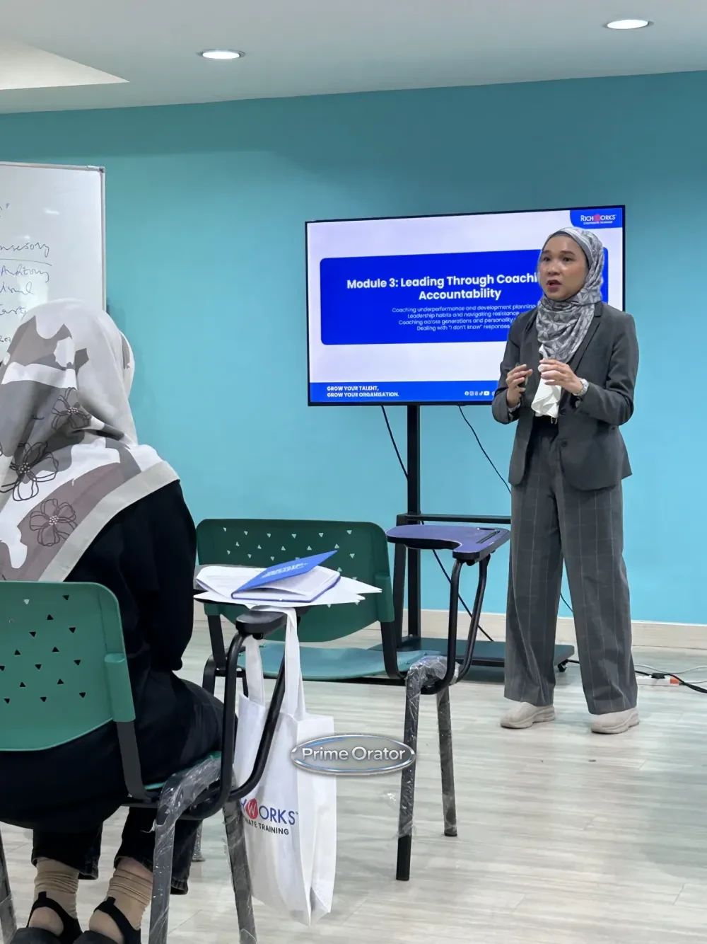 Trainer presenting a coaching accountability module to participants during a Coaching Mindset for Leaders session