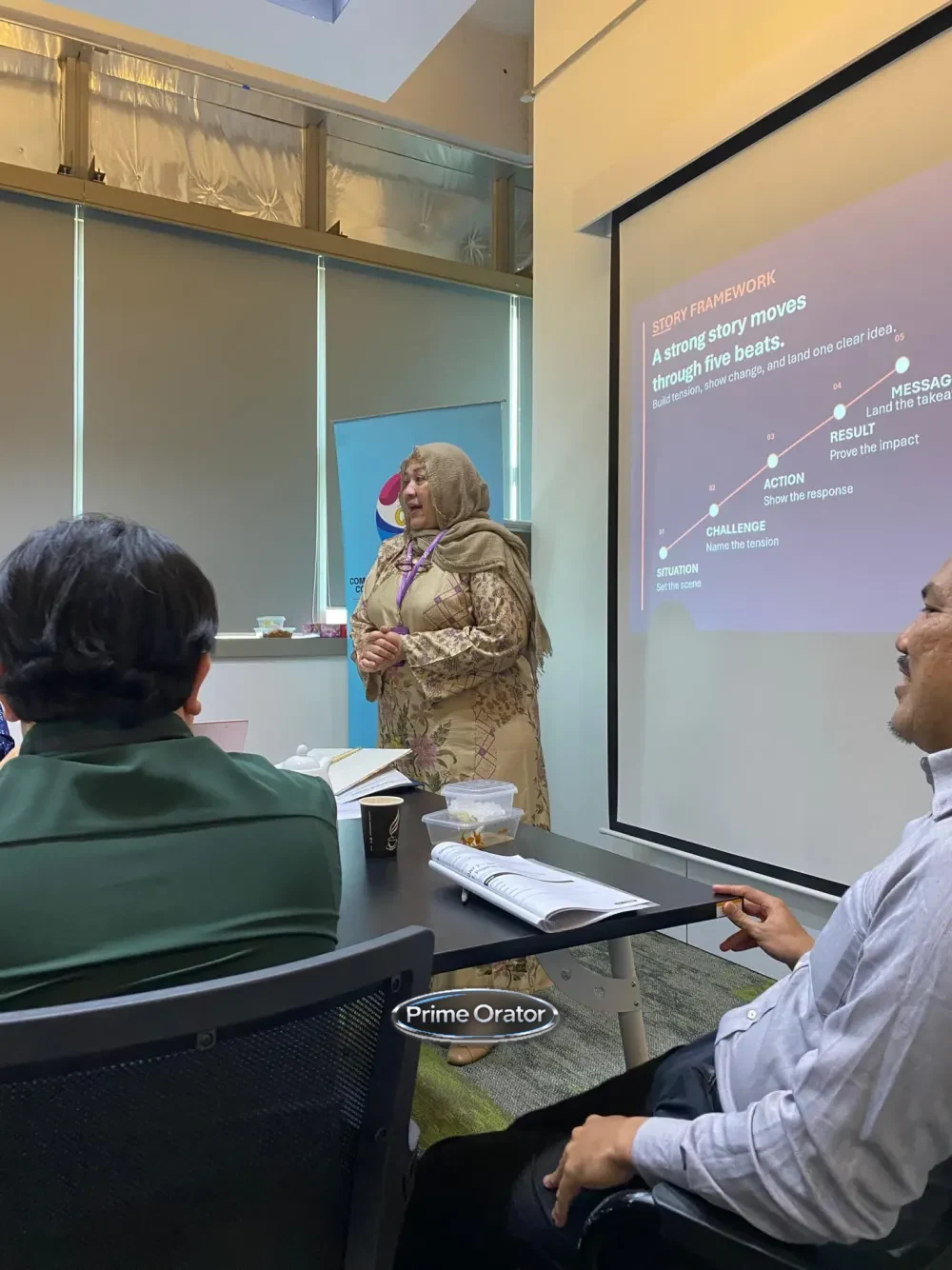 Trainer presenting a storytelling framework slide during a leadership communication session