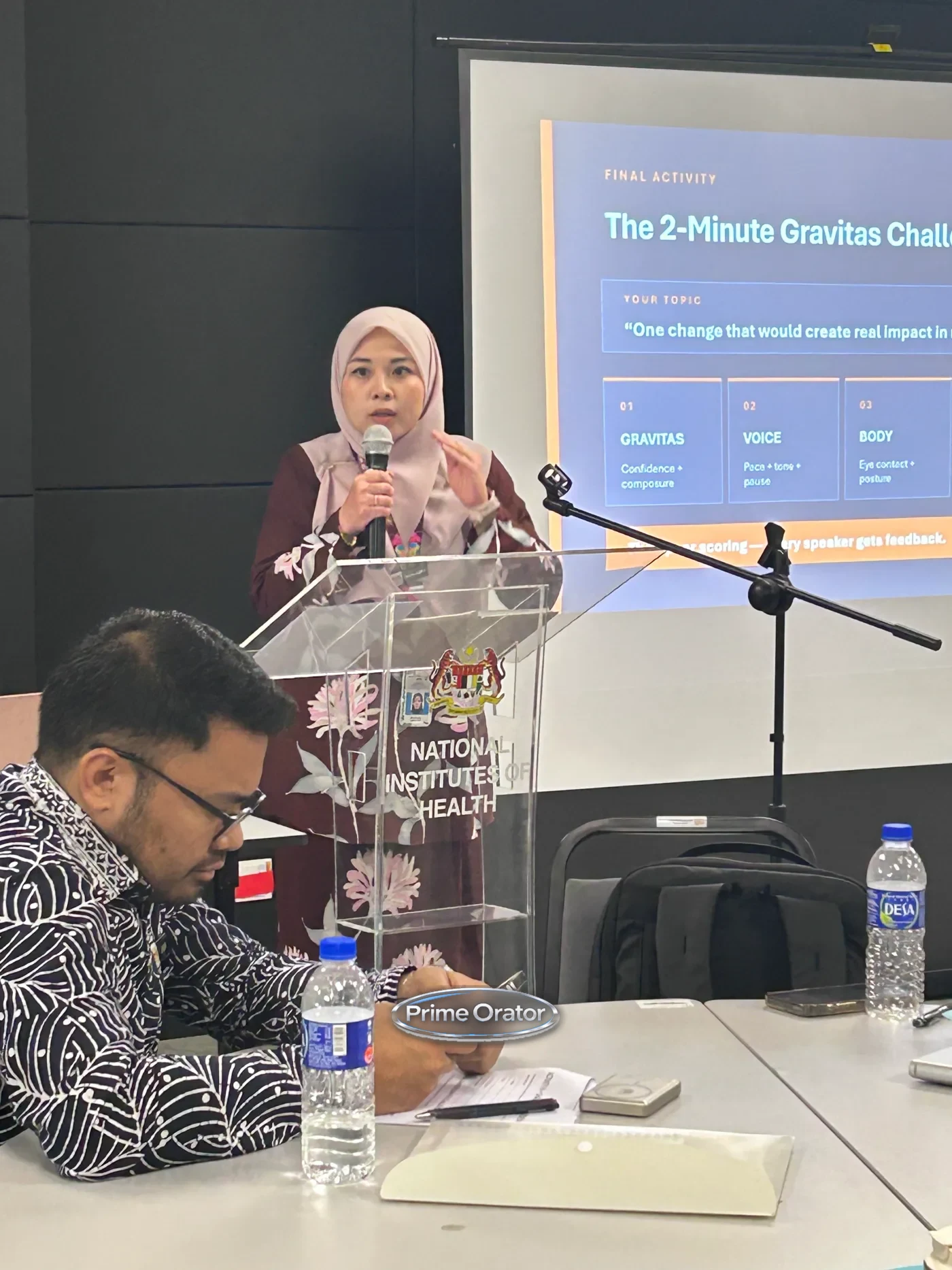 Prime Orator trainer leading the 2-Minute Gravitas Challenge exercise on confidence, voice and body language at a leadership essentials session